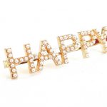 Κλιπ μαλλιών με τη λέξη HAPPY