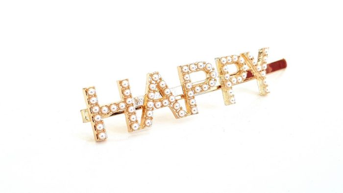 Hair clip with the word HAPPY