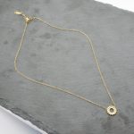 Ατσάλινο κολιέ με δαχτυλίδι από στρας, σε χρυσό χρώμα