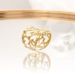 Aτσάλινο δαχτυλίδι με πλέγμα από καρδιές, σε χρυσό χρώμα!