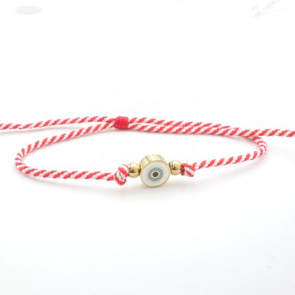 Βραχιόλι - "μαρτάκι" με ανθεκτικό κόκκινο και λευκό πλεγμένο σχοινί. Έχει ατσάλινο στοιχείο κυκλικό στοιχείο με ματάκι, χρυσού χρώματος.